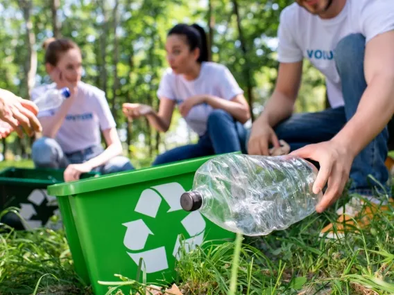 people picking up recyclables